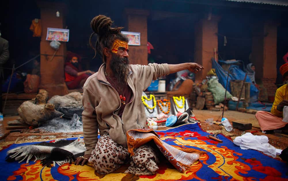 A Hindu holy man talks to his devotee during the