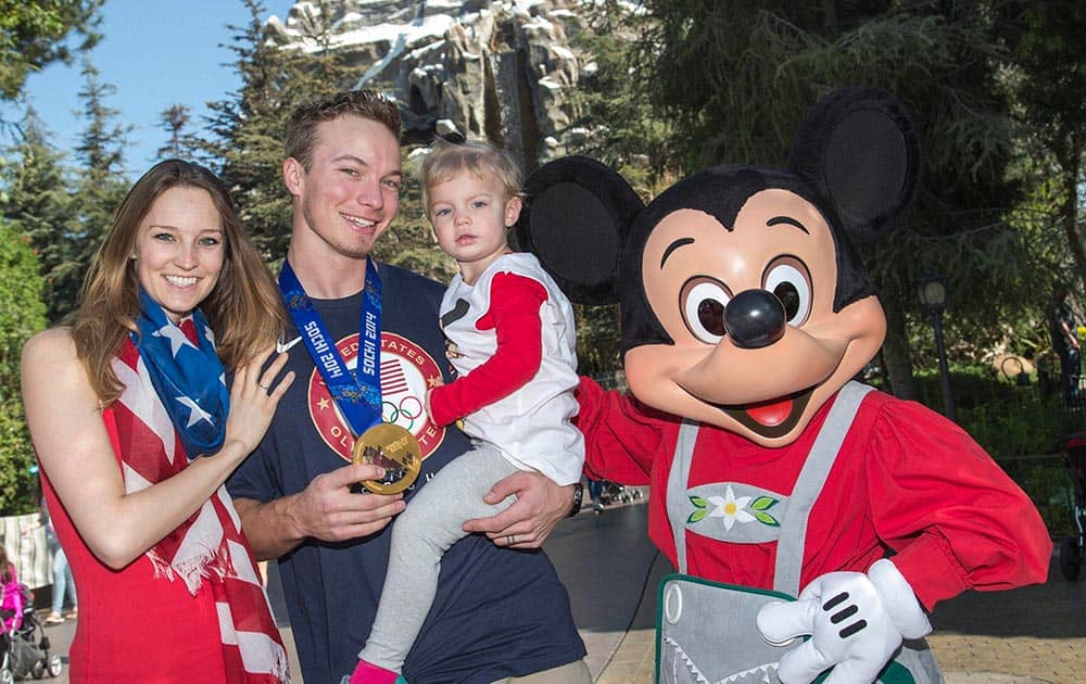 Olympic gold medallist David Wise poses with his wife, Alexandra, daughter Nayeli, 2, and Mickey Mouse at Disneyland in Anaheim, Calif.
