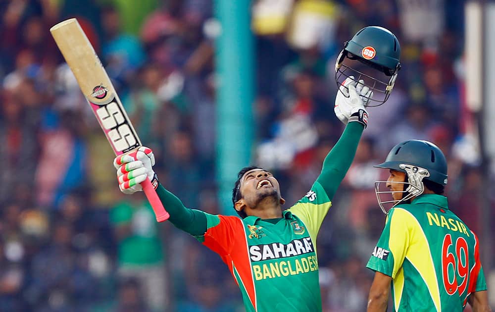 Bangladesh`s Mushfiqur Rahim celebrates after scoring a century, as Nasir Hossain smiles during the Asia Cup one-day international cricket tournament against India in Fatullah, near Dhaka, Bangladesh.