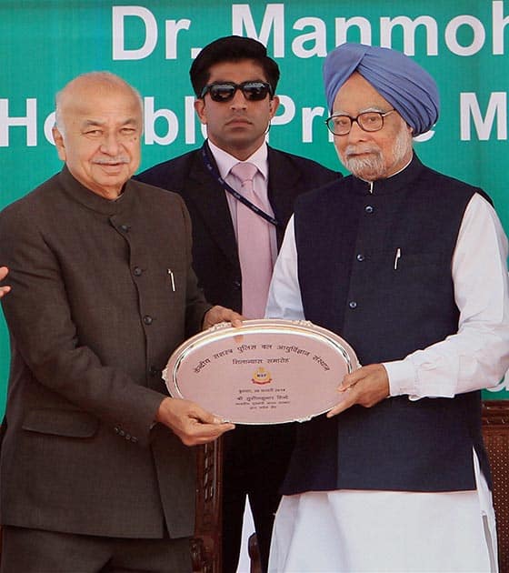 Prime Minister Manmohan Singh receives a memento from Home Minister Sushilkumar Shinde during laying of foundation stone of Central Armed Police Forces Institute of Medical Sciences (CAPFIMS) in New Delhi.