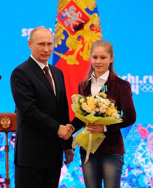 Russian President Vladimir Putin greets Russian Olympic champion in figure skating Julia Lipnitskaia after the Sochi 2014 Winter Olympics in Sochi, Russia.