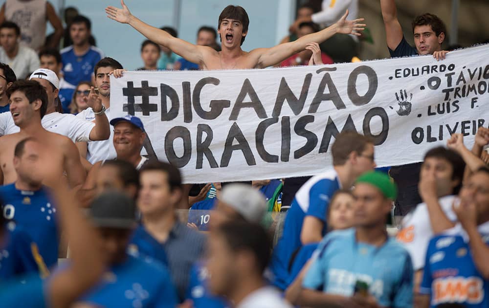 Fans of Brazil`s Cruzeiro hold a banner that reads `Say No to Racism` during their game against Chile`s Universidad de Chile at a Copa Libertadores soccer match in Belo Horizonte, Brazil.
