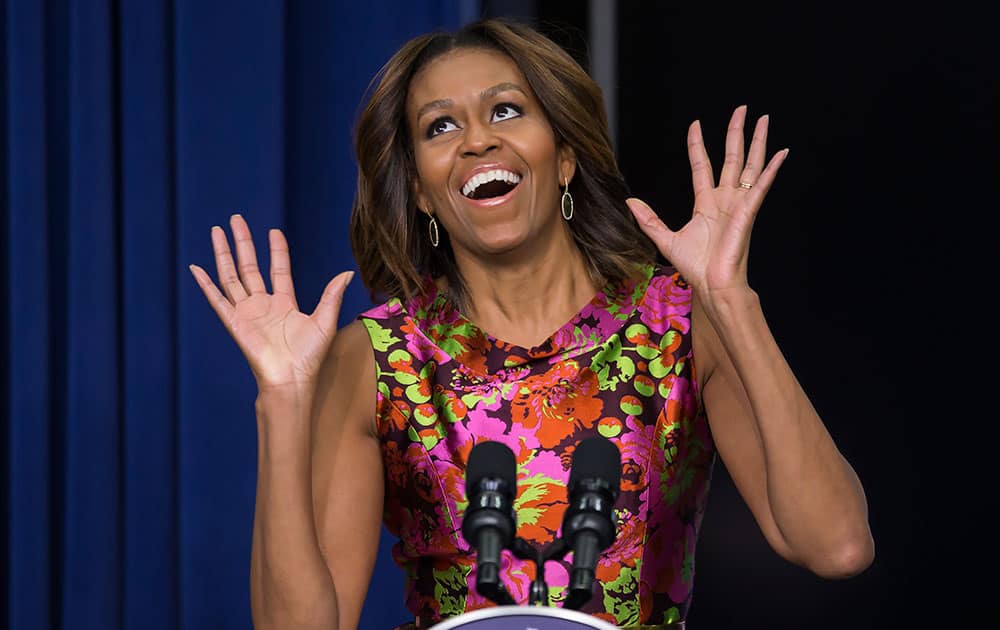 First lady Michelle Obama reacts as she introduces the cast of `The Trip to Bountiful` after a screening the movie, in the South Court Auditorium on the White House complex in Washington.
