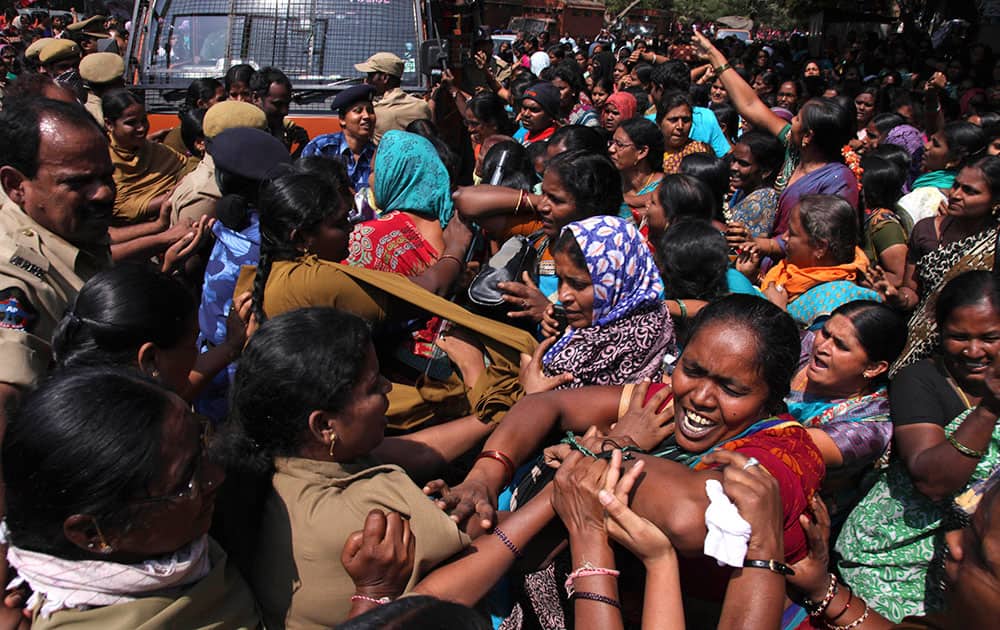Workers of Anganwadi, or government-sponsored childcare and mother care, tussle with police who tried to detain them during a protest in Hyderabad.