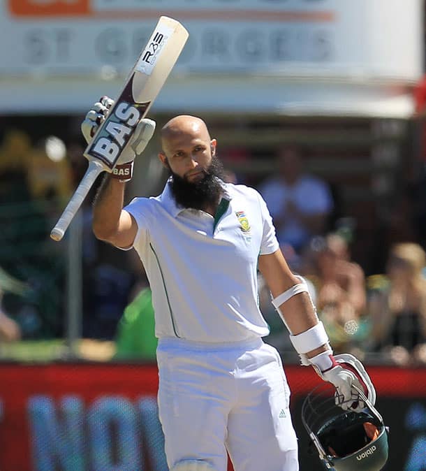 South Africa`s batsman Hashim Amla, raises his bat after reaching his century on the fourth day of their second cricket test match against Australia at St George`s Park in Port Elizabeth, South Africa.