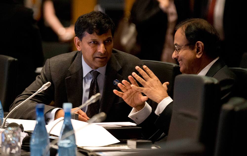 India`s Reserve Bank Governor Raghuram Rajan speaks with India`s Finance Minister Palaniappam Chidanbarum during the opening session of the G20 Finance Ministers and Central Bank Governors meeting in Sydney, Australia.