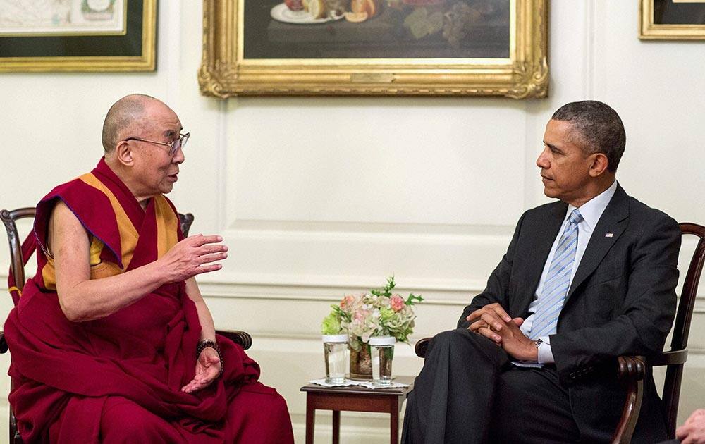 President Barack Obama meets with Tibetan spiritual leader the Dalai Lama in the Map Room of the White House in Washington.
