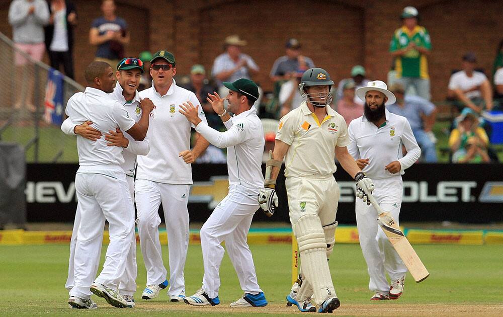 Australia`s batsman Chris Rogers, leaves the field after dismissed by by South Africa`s bowler Vernon Philander, for 5 runs on the second day of their 2nd cricket test match at St George`s Park in Port Elizabeth, South Africa.