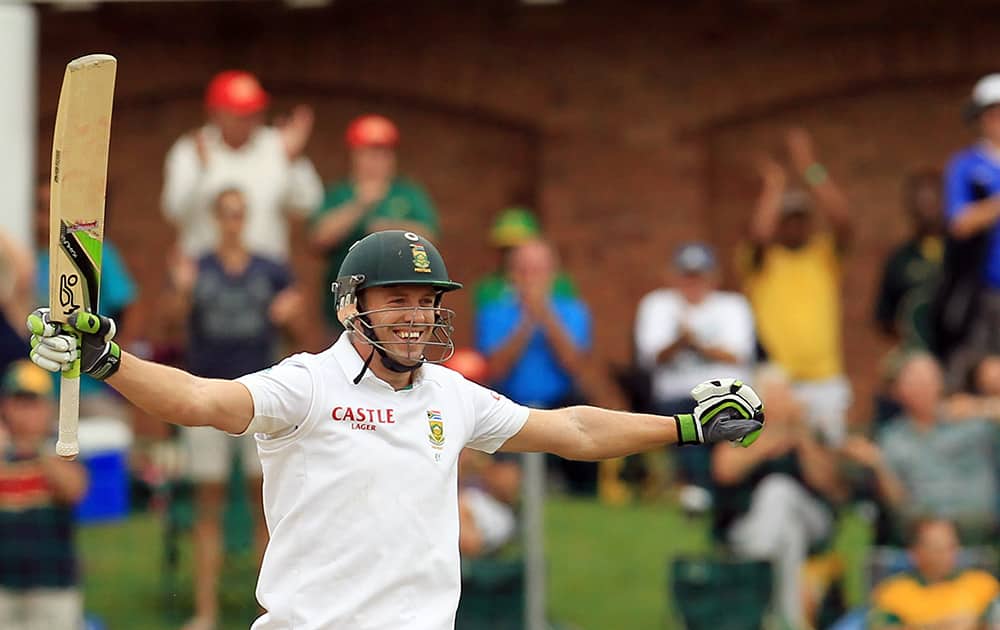 South Africa`s batsman AB de Villiers, celebrates his century on the second day of their 2nd cricket test match against Australia at St George`s Park in Port Elizabeth, South Africa.