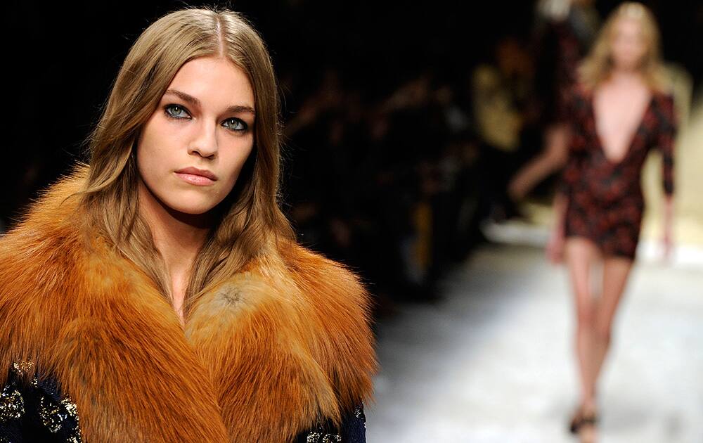 A model wears a creation for Blumarine women`s Fall-Winter 2014-15 collection, part of the Milan Fashion Week, unveiled in Milan, Italy.