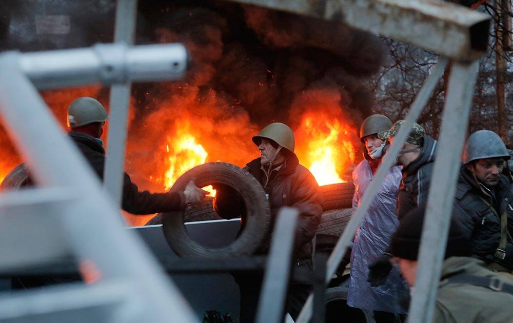 Activists burn tyres at barricades close to Independence Square, the epicenter of the country`s current unrest, in Kiev, Ukraine.