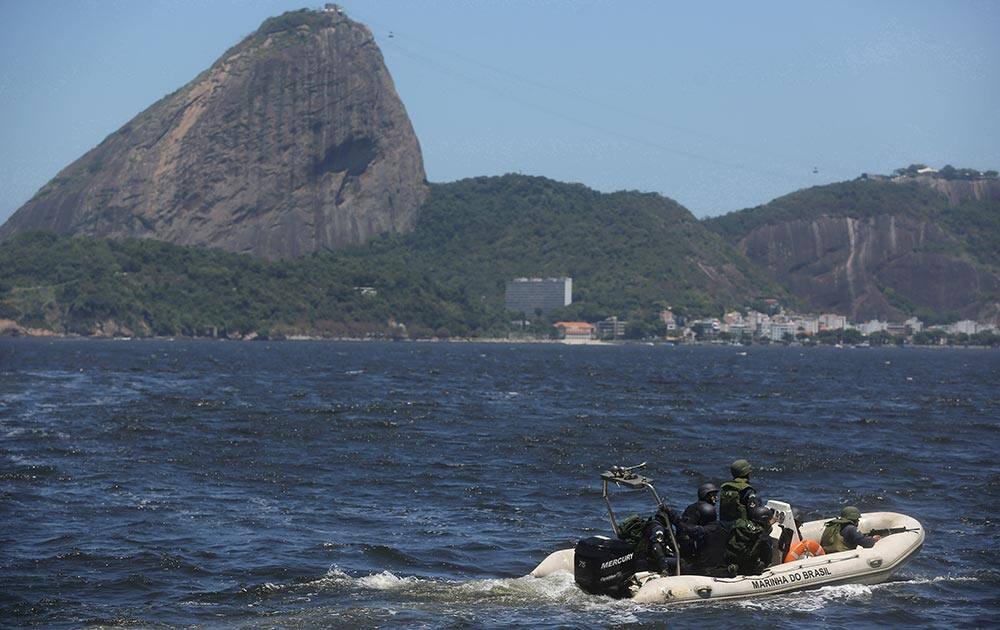 Brazilian marines sail past Sugar Loaf mountain in a speed boat during a military exercise in Guanabara Bay, in Rio de Janeiro, Brazil.