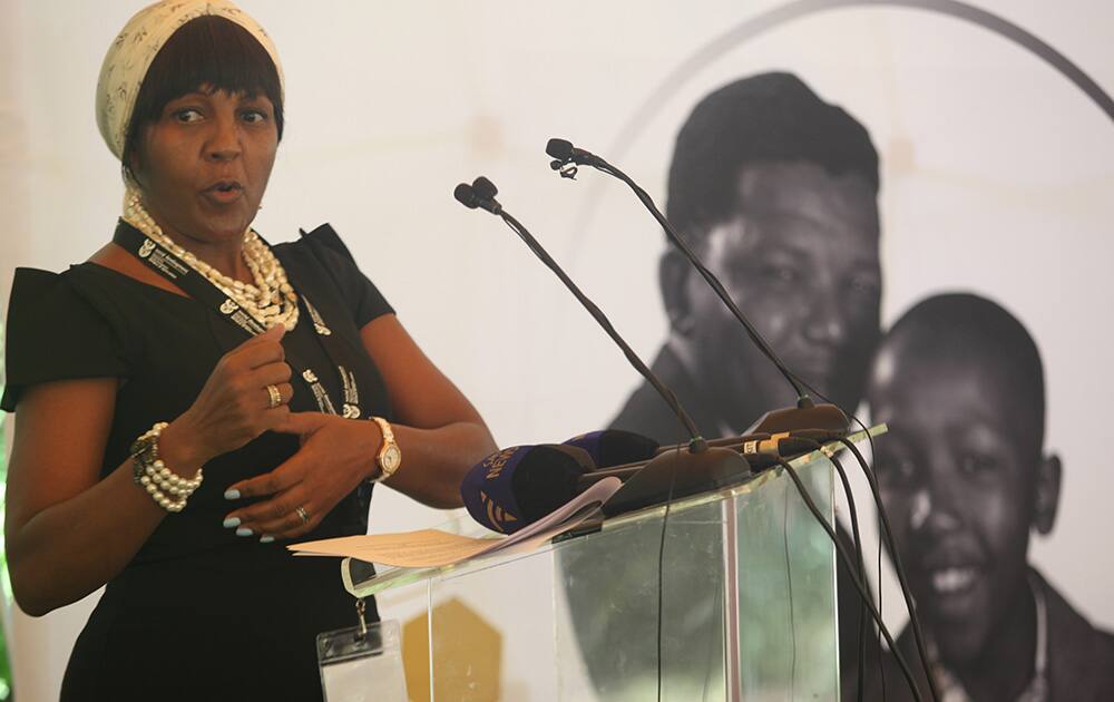 Ndileka Mandela, the granddaughter of former president Nelson Mandela, back left, and daughter of his son, Thembekile Mandela, back right, at the launch of the Thembekile Mandela Foundation in Johannesburg.