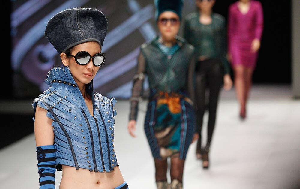 Models show creations by Mardiana Ika during the Indonesia Fashion Week 2014 in Jakarta, Indonesia.