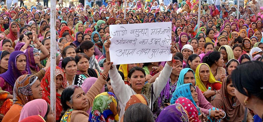 Anganwadi women display a placard against Rajasthan Chief Minister Vasundhara Raje at a protest demonstration to press for their demands in Jaipur.