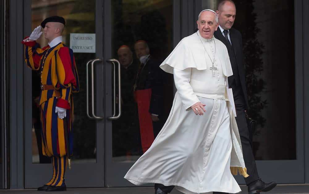 Pope Francis leaves after the first session of an extraordinary consistory in the Synod hall at the Vatican City.