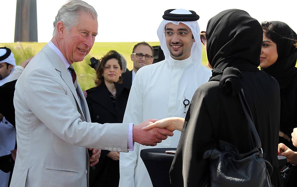 Britain`s Prince Charles meets young Qatari environmentalists in the Museum of Islamic Arts Park in Doha, Qatar.