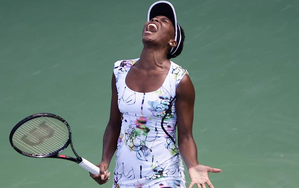 Venus Williams of the US reacts during a match against Flavia Pennetta of Italy during the quarter final of Dubai Duty Free Tennis Championships in Dubai, United Arab Emirates.
