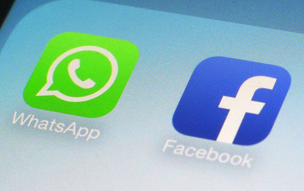 This photo shows the WhatsApp and Facebook app icons on an iPhone in New York. On Wednesday the world`s biggest social networking company, Facebook, announced it is buying mobile messaging service WhatsApp for up to $19 billion in cash and stock.