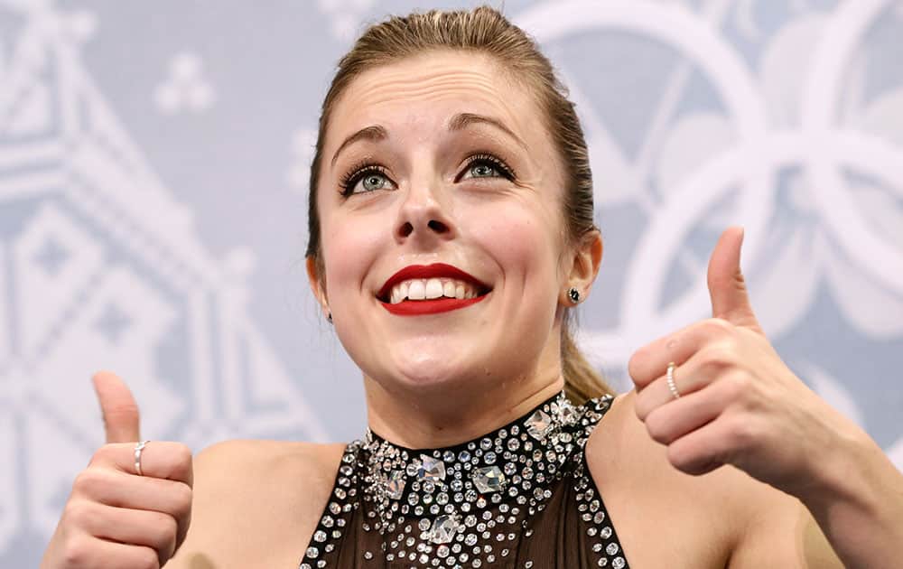 Ashley Wagner of the United States gestures to spectators as she waits in the results area after completing her routine in the women`s short program figure skating competition at the Iceberg Skating Palace during the 2014 Winter Olympics in Sochi, Russia.