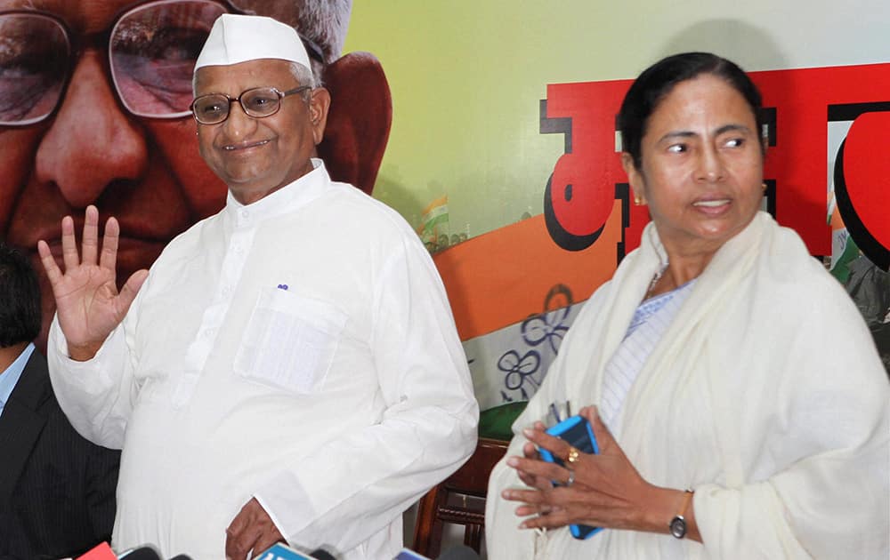 Social activist Anna Hazare with West Bengal CM Mamata Banerjee during a press conference in New Delhi.