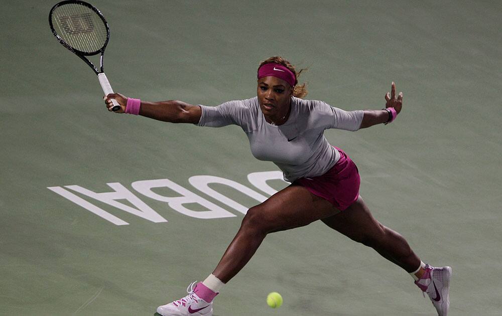 Serena Williams of the US returns the ball to Ekaterina Makarova of Russia during the second round of Dubai Duty Free Tennis Championships.