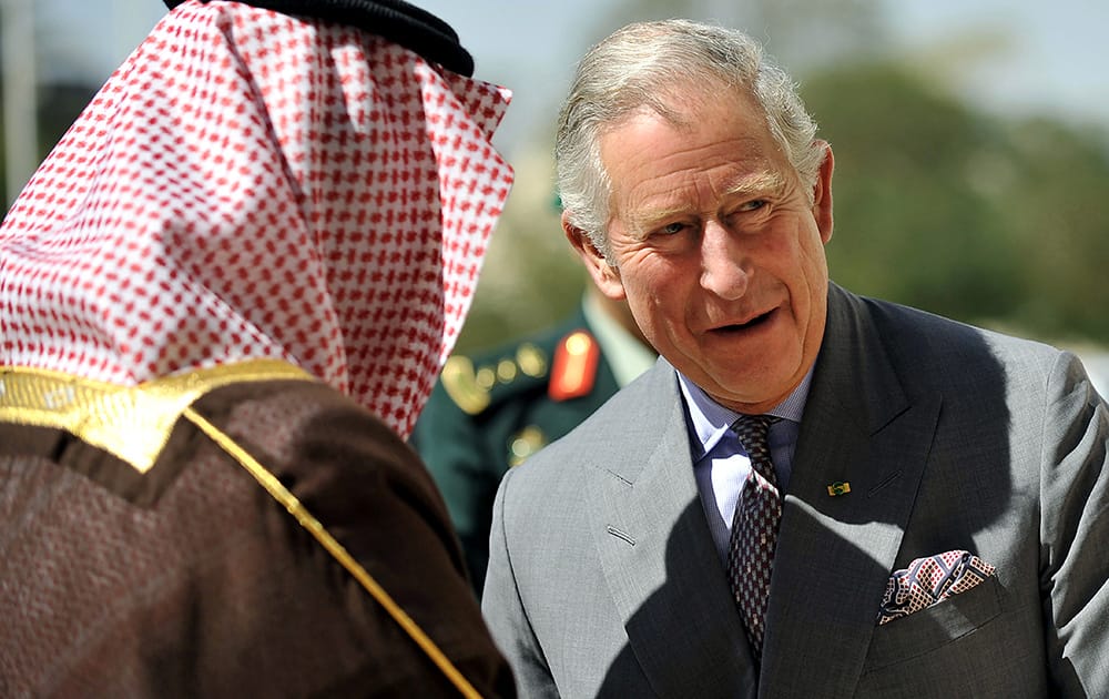 Saudi Arabia`s Foreign Minister Prince Saud al-Faisal greets Britain`s Prince Charles ahead of their meeting in Riyadh, Saudi Arabia.