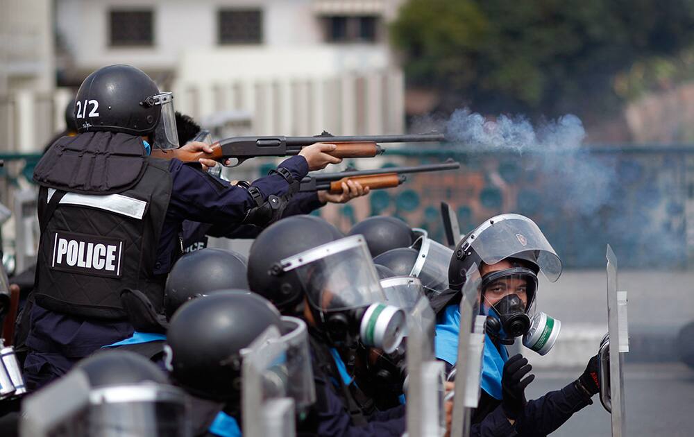 Riot police fire rubber bullets into the crowds of anti-government protesters during clashes in Bangkok, Thailand.