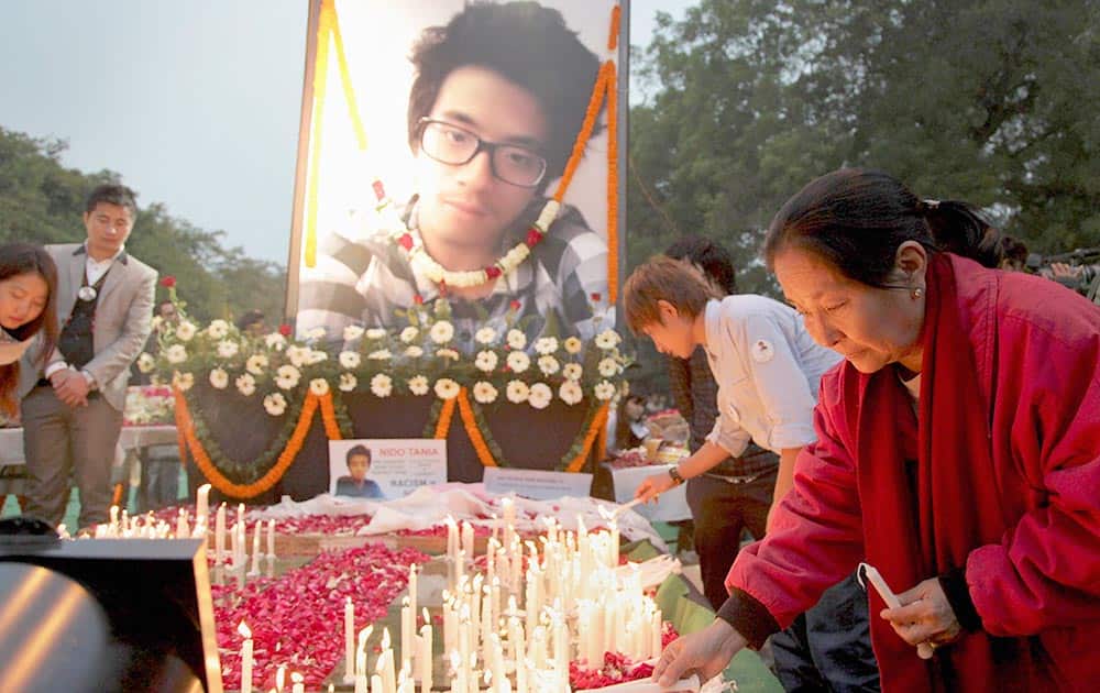 Supporters of Nido Taniam, a 20-year-old university student, light candles at Jantar Mantar in New Delhi.