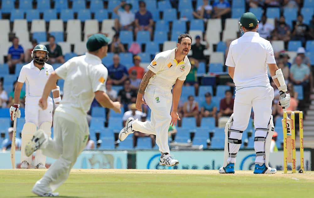Australia`s bowler Mitchell Johnson celebrates after dismissing South Africa`s captain Graeme Smith, right, for 4 runs on the fourth day of their their cricket test match against South Africa at Centurion Park in Pretoria, South Africa.