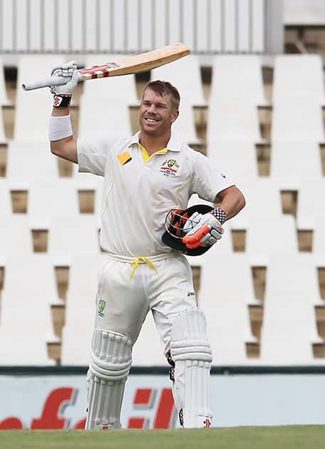 Australia`s batsman David Warner, raises his bat after reaching a century on the third day of their cricket test match against South Africa at Centurion Park in Pretoria, South Africa.