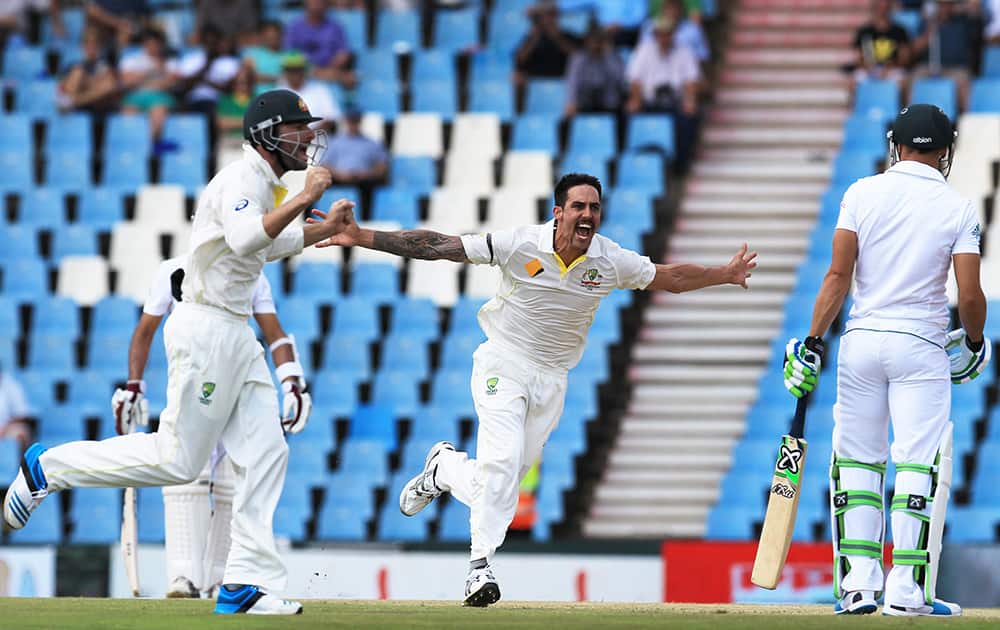Australia`s bowler Mitchell Johnson reacts after dismissing South Africa`s batsman Faf du Plessis for 3 runs on the second day of their their cricket test match at Centurion Park in Pretoria, South Africa.
