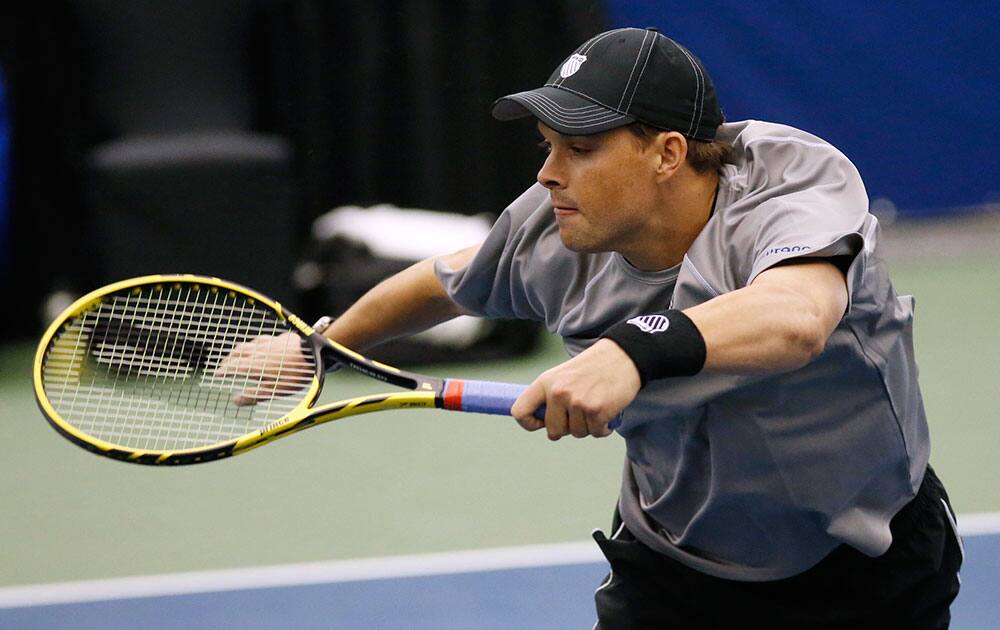 Bob Bryan hits a return to the doubles team of David O`Hare of Ireland and Joe Salisbury of Britain at the U.S. National Indoor Tennis Championships, in Memphis, Tenn. Bob and Mike Bryan won 6-4, 6-3.