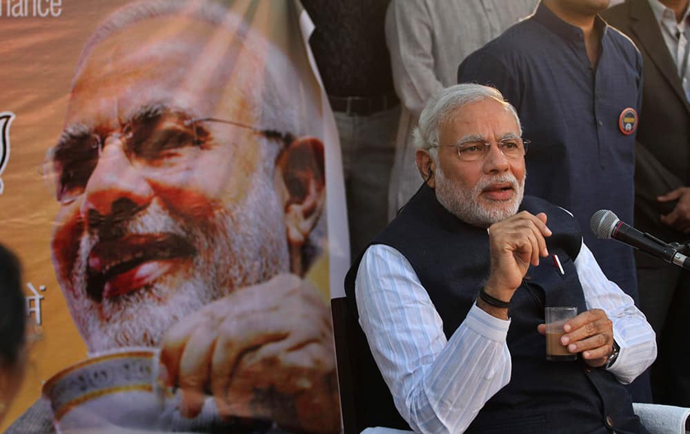 Narendra Modi, interacts with people as he launches the ` discussion over tea` campaign in Ahmadabad.