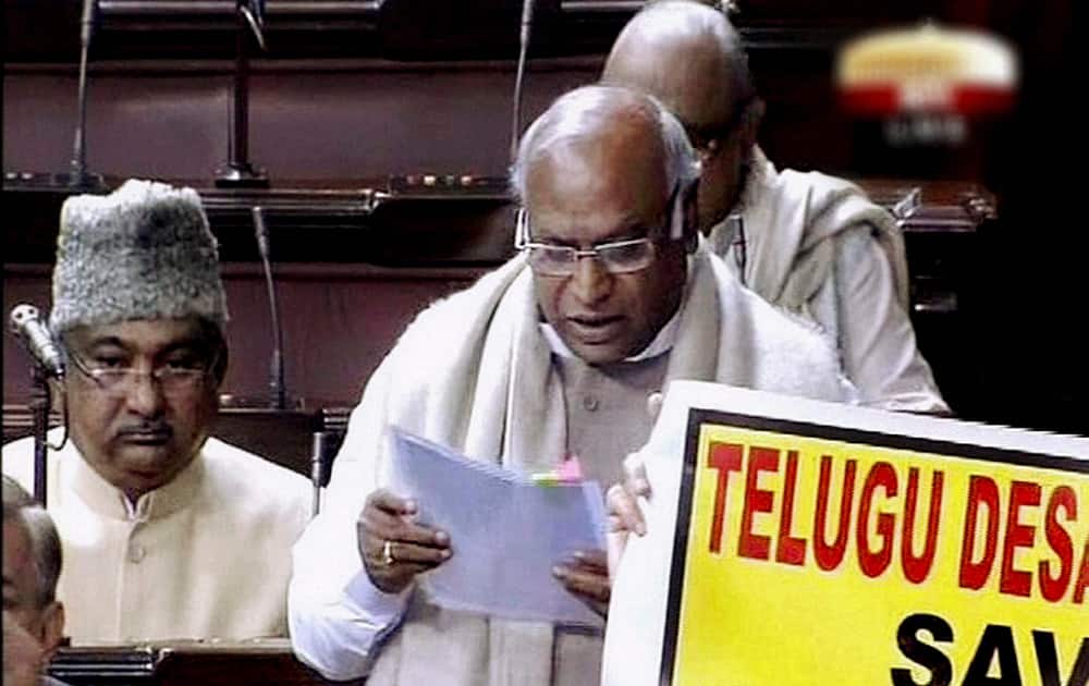 Railways Minister Mallikarjun Kharge presenting the interim rail budget in the Lok Sabha amid protest by TDP members during the extended winter session in New Delhi.