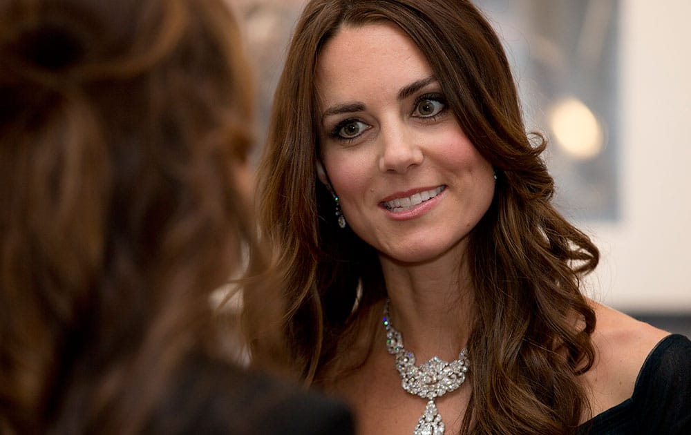 Kate Duchess of Cambridge talks to guests at a fund raising gala at the National Portrait Gallery in London.