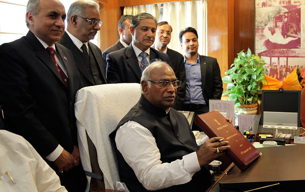 Indian Railway Minister Mallikarjun Kharge holds the interim Railway Budget to be presented in parliament. Kharge is likely to announce more trains, new lines and better passenger amenities in the interim budget, according to local reports.