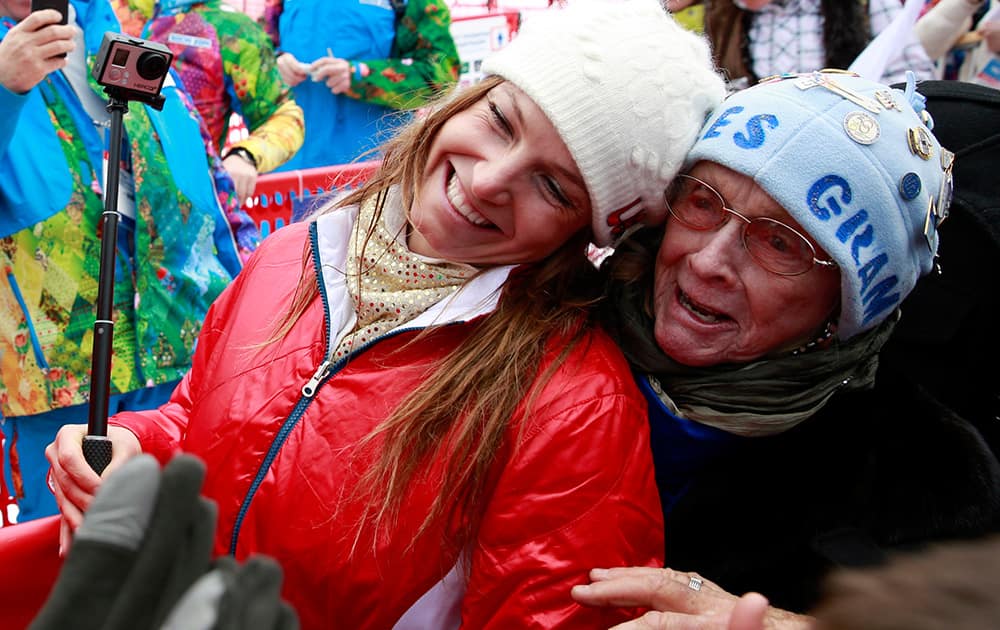Women`s supercombined bronze medal winner United States` Julia Mancuso and her grandmother Sheila Tuffanelli are surrounded by well-wishers at the Alpine ski venue at the Sochi 2014 Winter Olympics in Krasnaya Polyana, Russia.