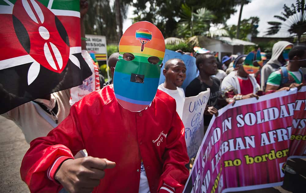 Kenyan gays and lesbians and others supporting their cause wear masks to preserve their anonymity as they stage a rare protest, against Uganda`s increasingly tough stance against homosexuality and in solidarity with their counterparts there, outside the Uganda High Commission in Nairobi, Kenya.