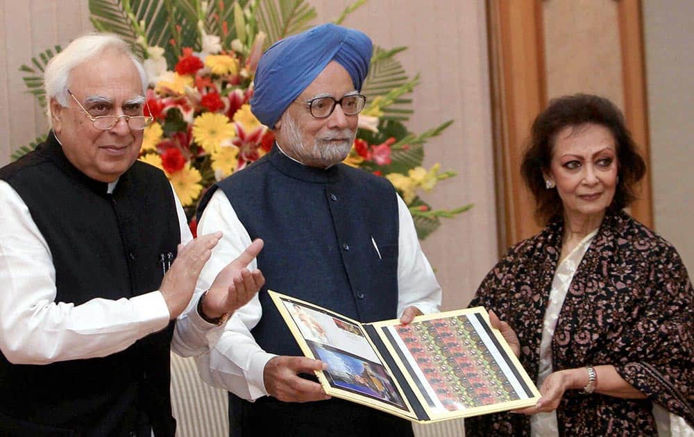 Prime Minister Manmohan Singh releases commemorative postage stamps on legendary singer Jagjit Singh on his birth anniversary in New Delhi.
