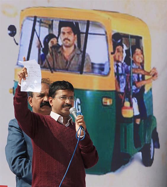 Delhi Chief Minister Arvind Kejriwal addresses auto-rickshaw drivers at a `mahasabha` (grand gathering) in Burari, New Delhi.