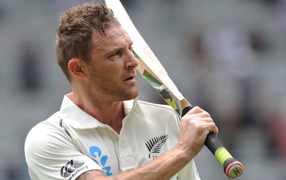 New Zealand’s Brendon McCullum salutes the crowd after being dismissed, caught on the boundary by India’s Ravindra Jadeja for 224 on the second day of the first cricket test at Eden Park in Auckland, New Zealand.