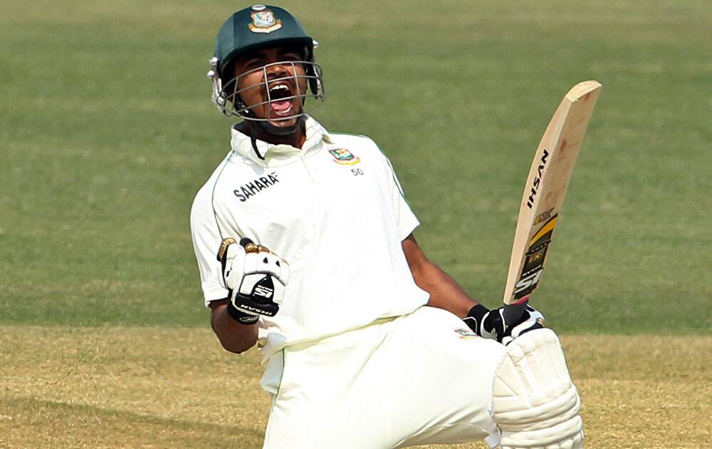 Bangladesh’s Shamsur Rahman celebrates after scoring a century on the third day of the second test cricket match against Sri Lanka in Chittagong, Bangladesh.