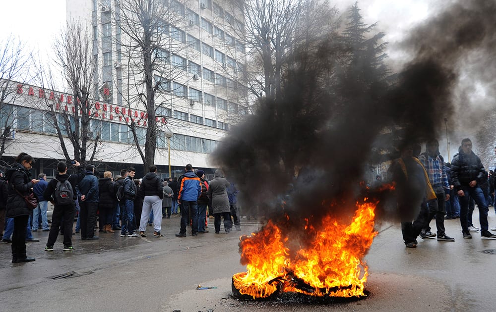 A tyre burns in the street as protesters stoned a local government building in the Bosnian town of Tuzla, 140 kms north of Sarajevo.