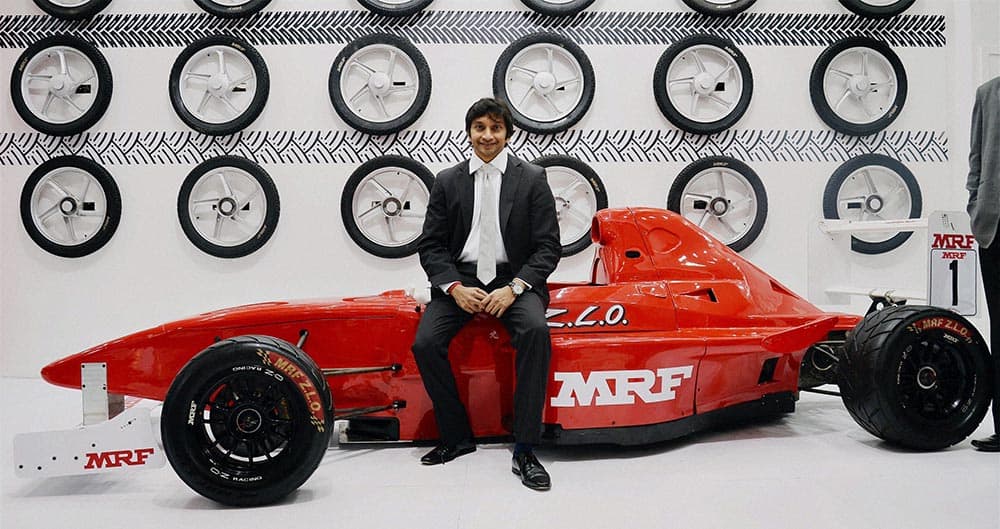 Formula One racing driver Narain Karthikeyan visits the MRF stall at the Auto Expo 2014 at Greater Noida.