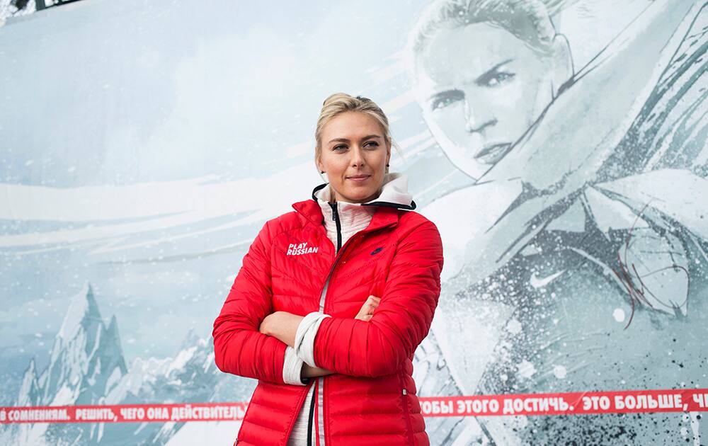 Russian tennis player Maria Sharapova poses for photographers while visiting her first court of Kafelnikov Tennis School in Riviera Park in Sochi, Russia.