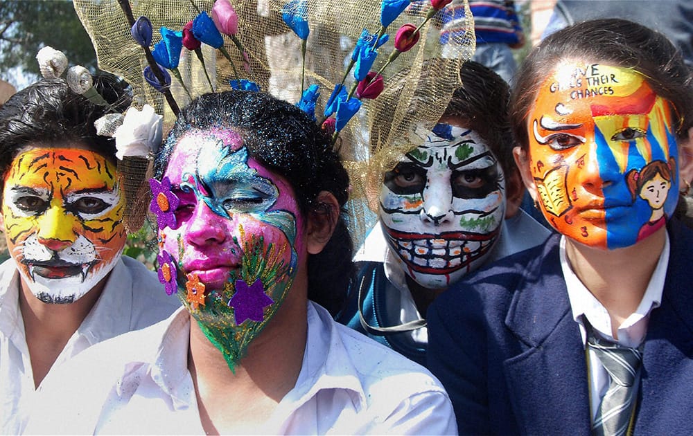 School children participate in face painting competition during 28th Surajkund International crafts Mela 2014 in Faridabad.