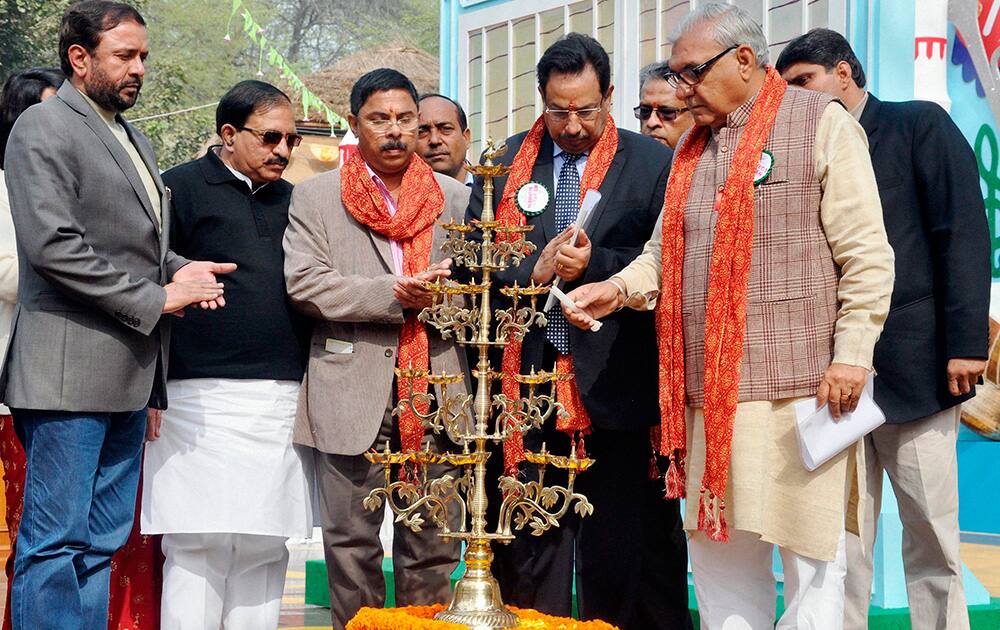 Haryana Chief Minister Bhupinder Singh Hooda lighting lamps during inauguration of International Crafts Mela in Surjakund near Faridabad.