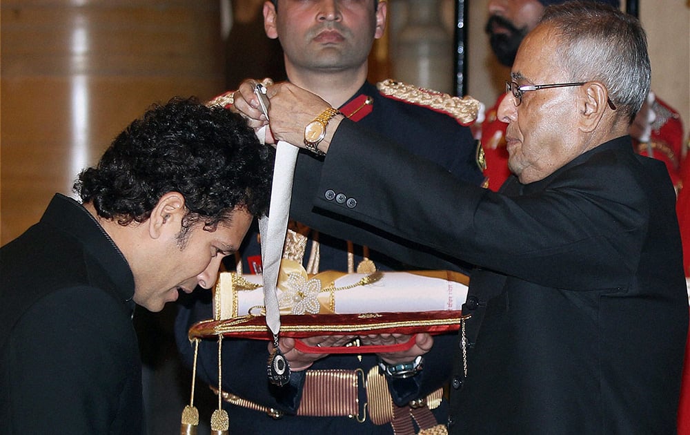 President Pranab Mukherjee confers the Bharat Ratna, India`s highest civilian award, on legendary cricketer Sachin Tendulkar during a ceremony at the Rashtrapati Bhavan in New Delhi.