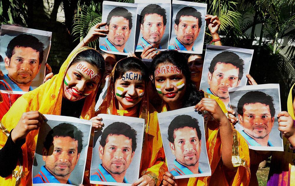 School children celebrate as ace cricketer Sachin Tendulkar gets country`s highest civilian award Bharat Ratna, in Moradabad.